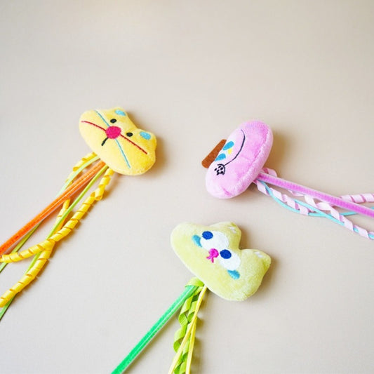 Close-up of Moo plush cat teaser wand showing detailed stitching and fabric texture