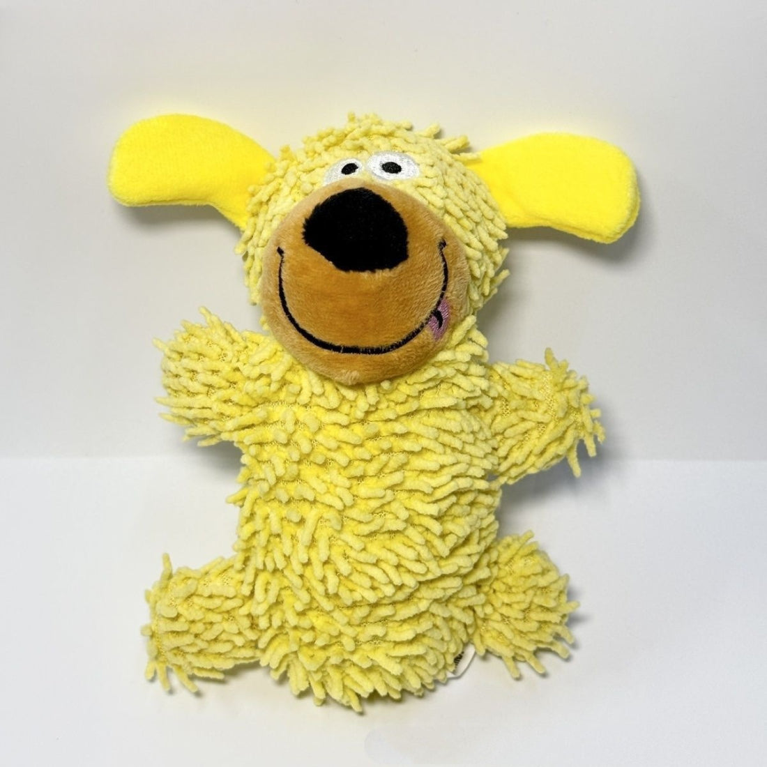 Petkin puppy dog toy lying down with floppy ears and a friendly expression