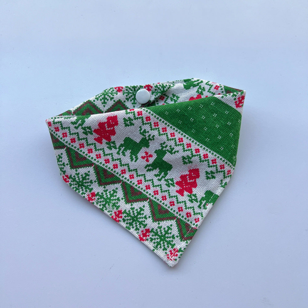 Green Bandana pet neckwear with green reindeer, red details and a white snap, shown fastened