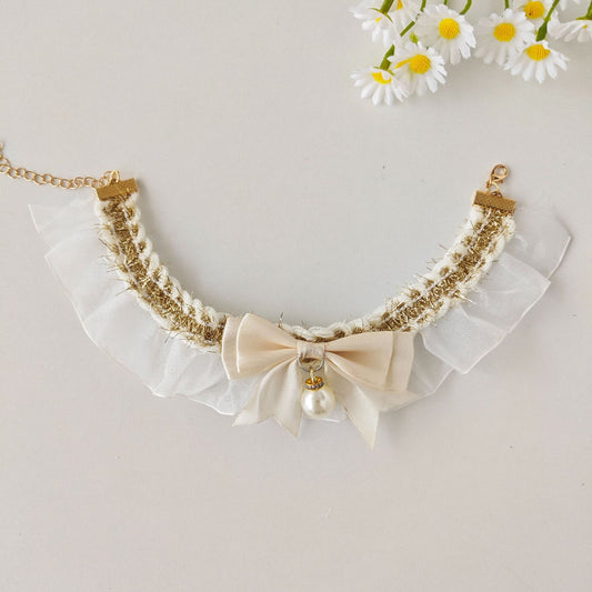 Close-up of lace bow charm detail on Mokka cat collar