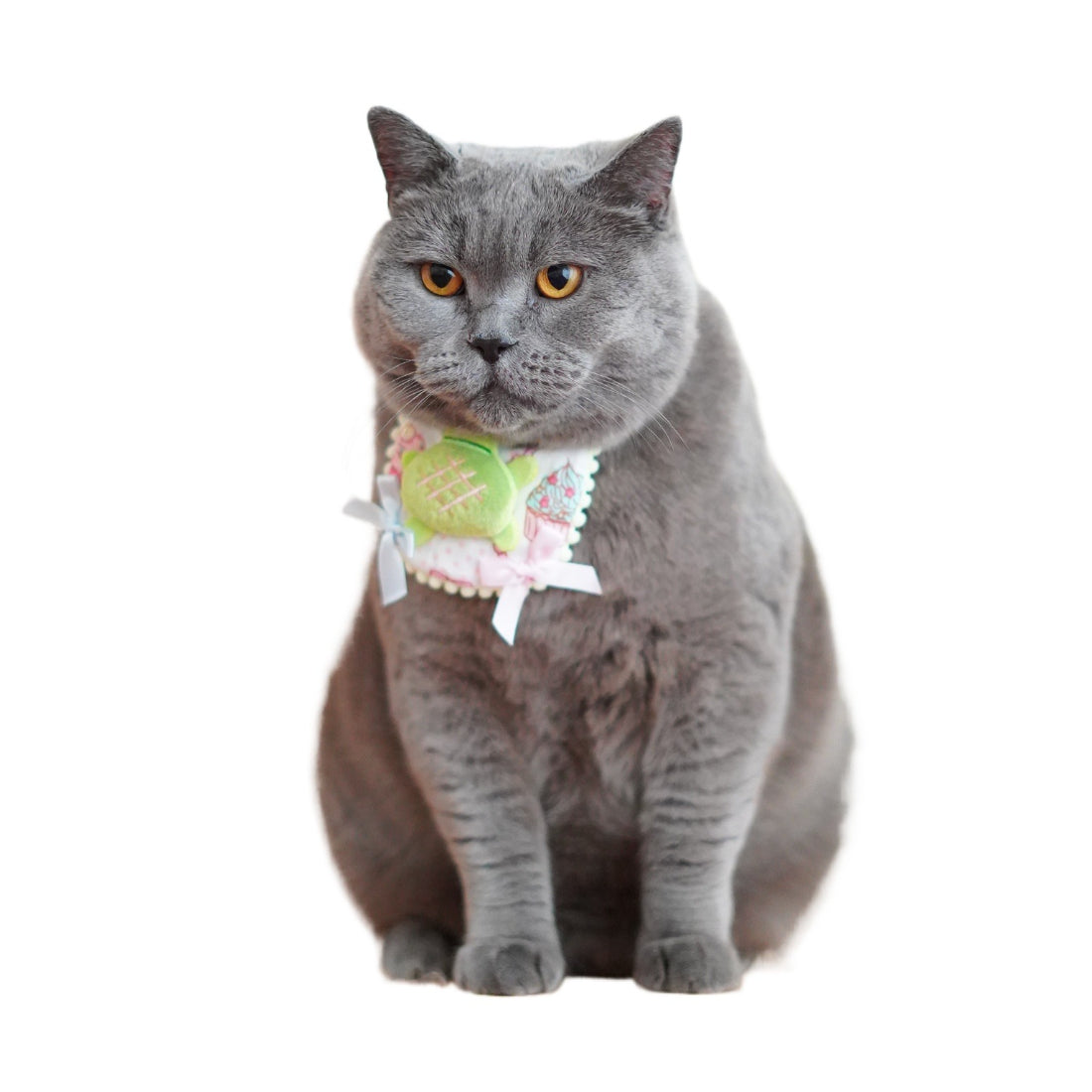 Mokka plush cat bib with soft pastel colors and embroidered cat features