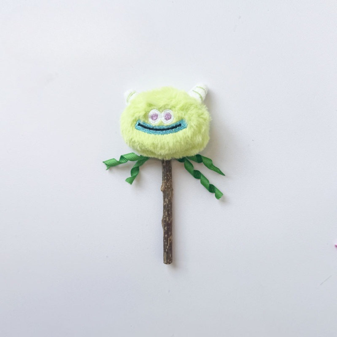 Moo cute monster cat stick toy displayed on white background with vibrant colors