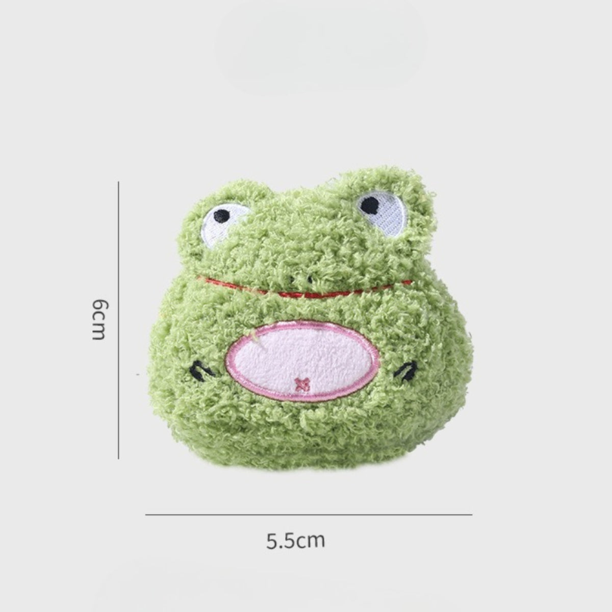 Petkin flat plush dog toy with cute animal face displayed on wooden surface