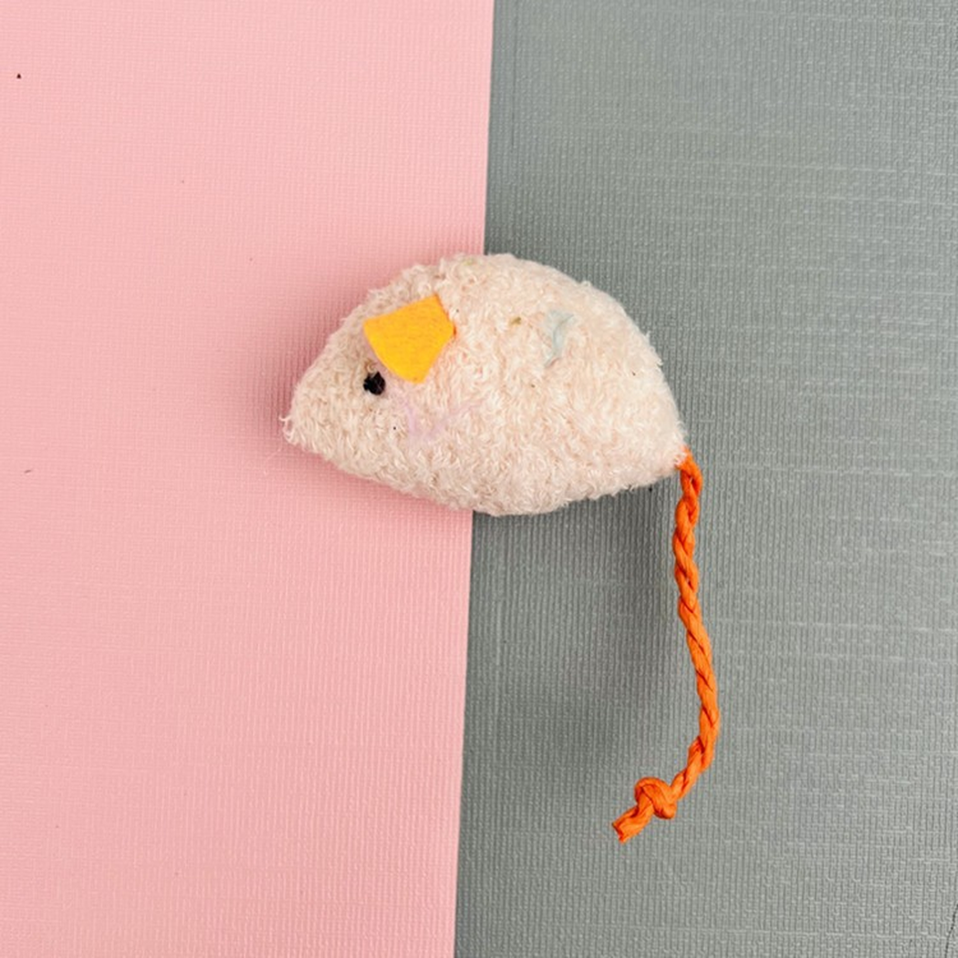 Light Pink mouse-shaped cat toy with orange ears and cord tail