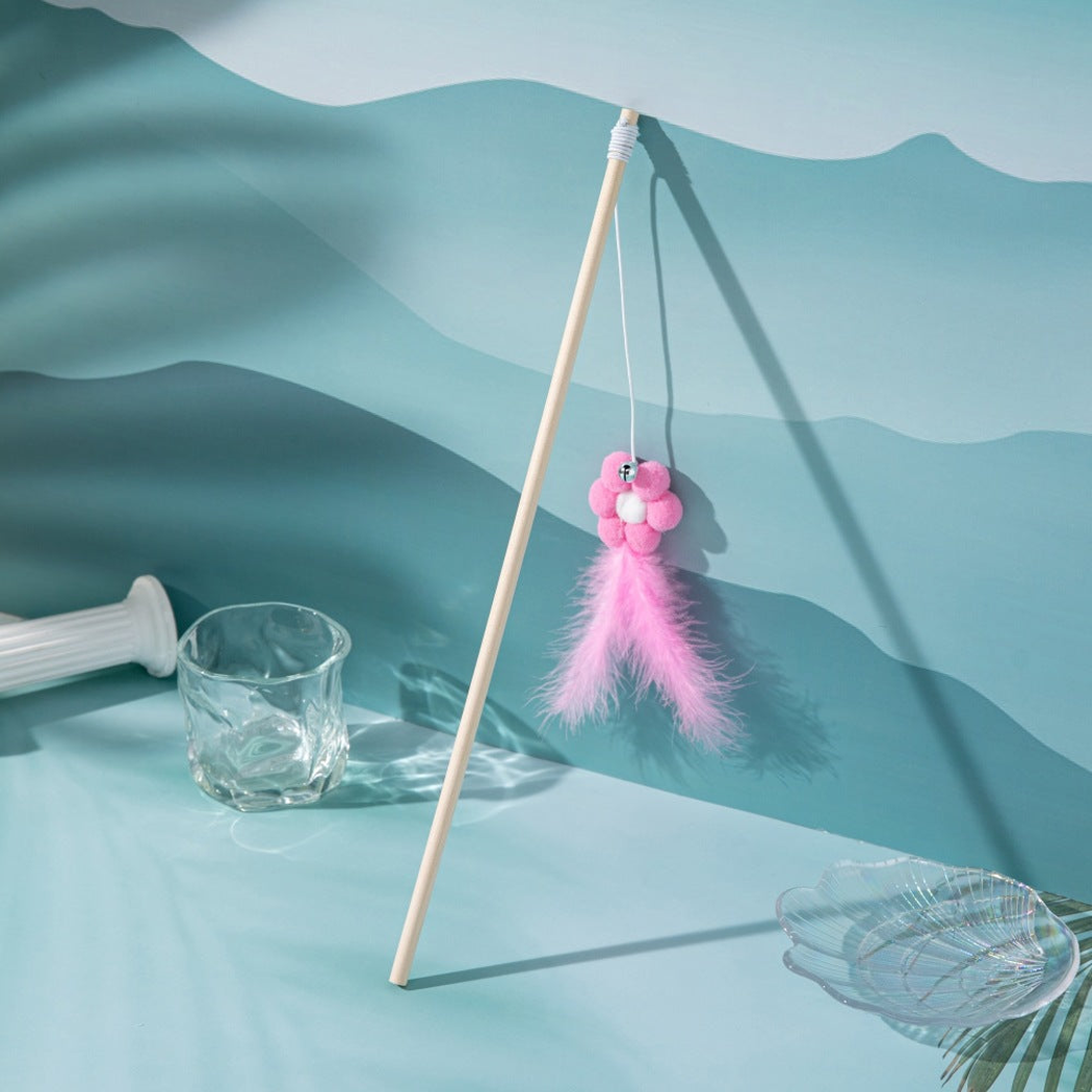 Pink flower wand cat toy with bell and feather tassel