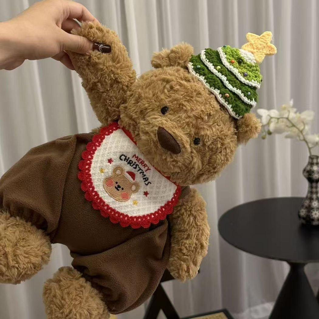 Christmas bear pet neckwear displayed on a teddy bear figure in a holiday hat
