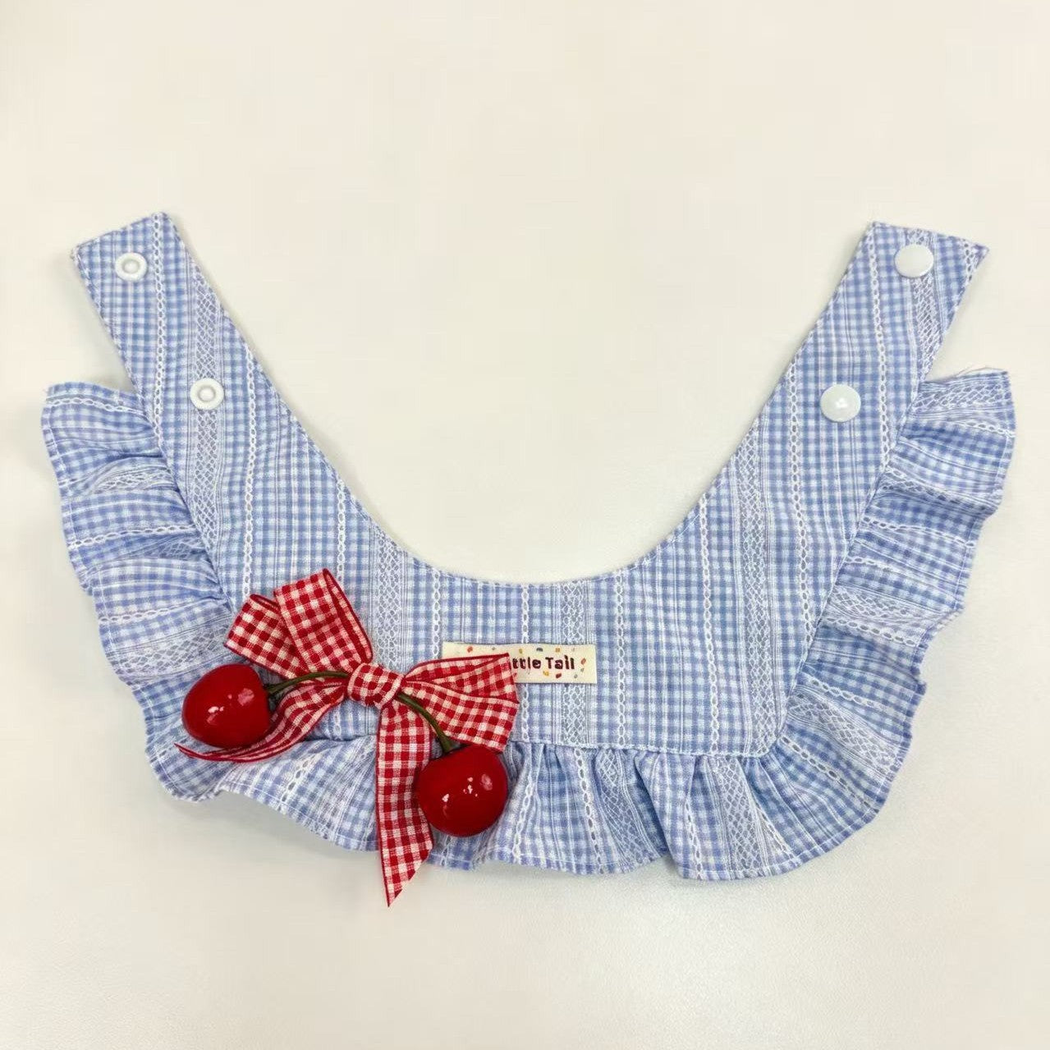 Back view of light blue gingham pet neckwear with adjustable snap fasteners