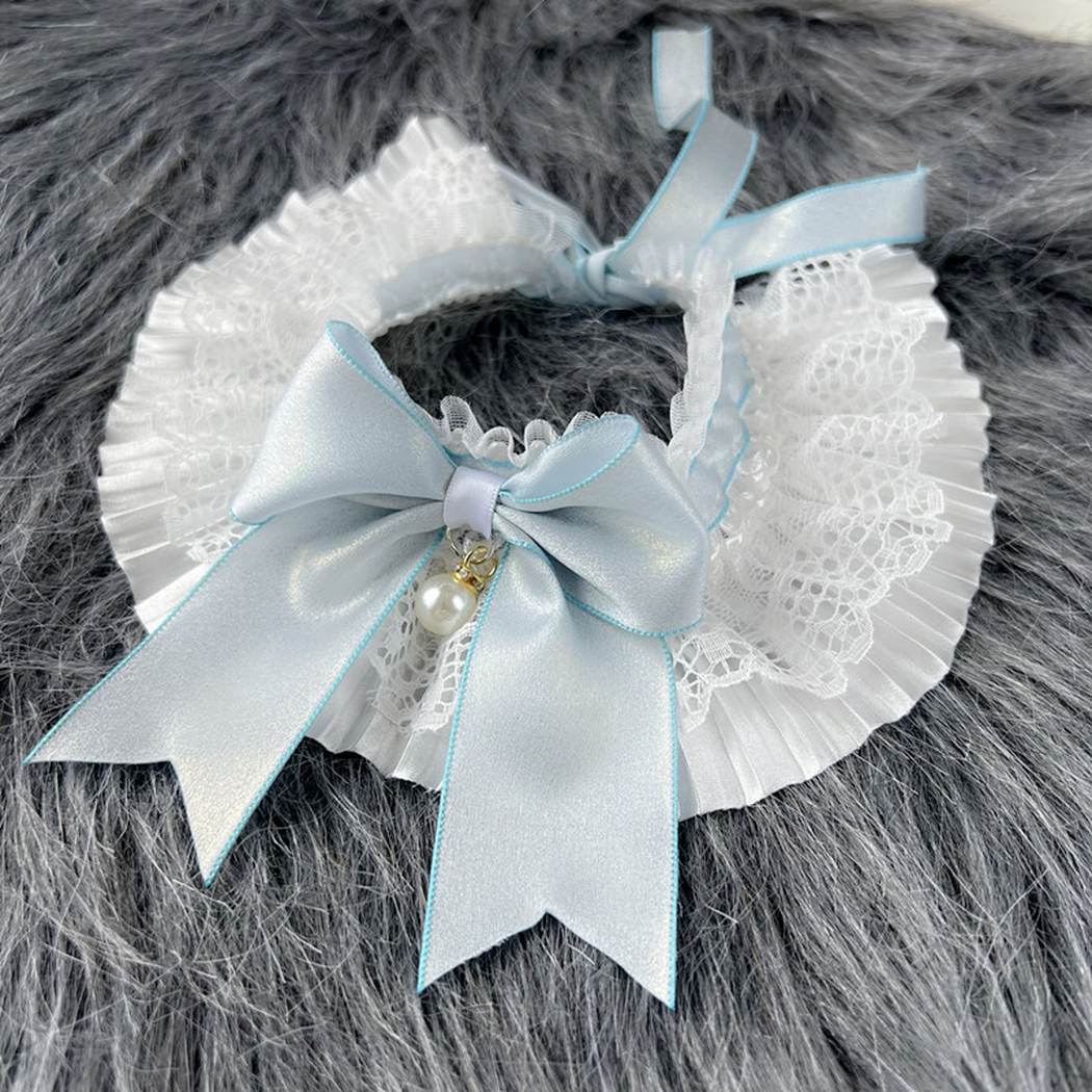Blue bow pet neckwear with pleated white ruffles and a pearl-look charm