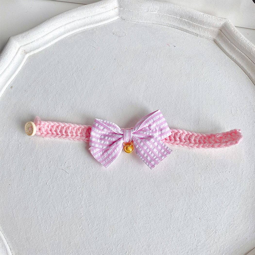 Light pink cat collar with striped bow and gold-tone bell