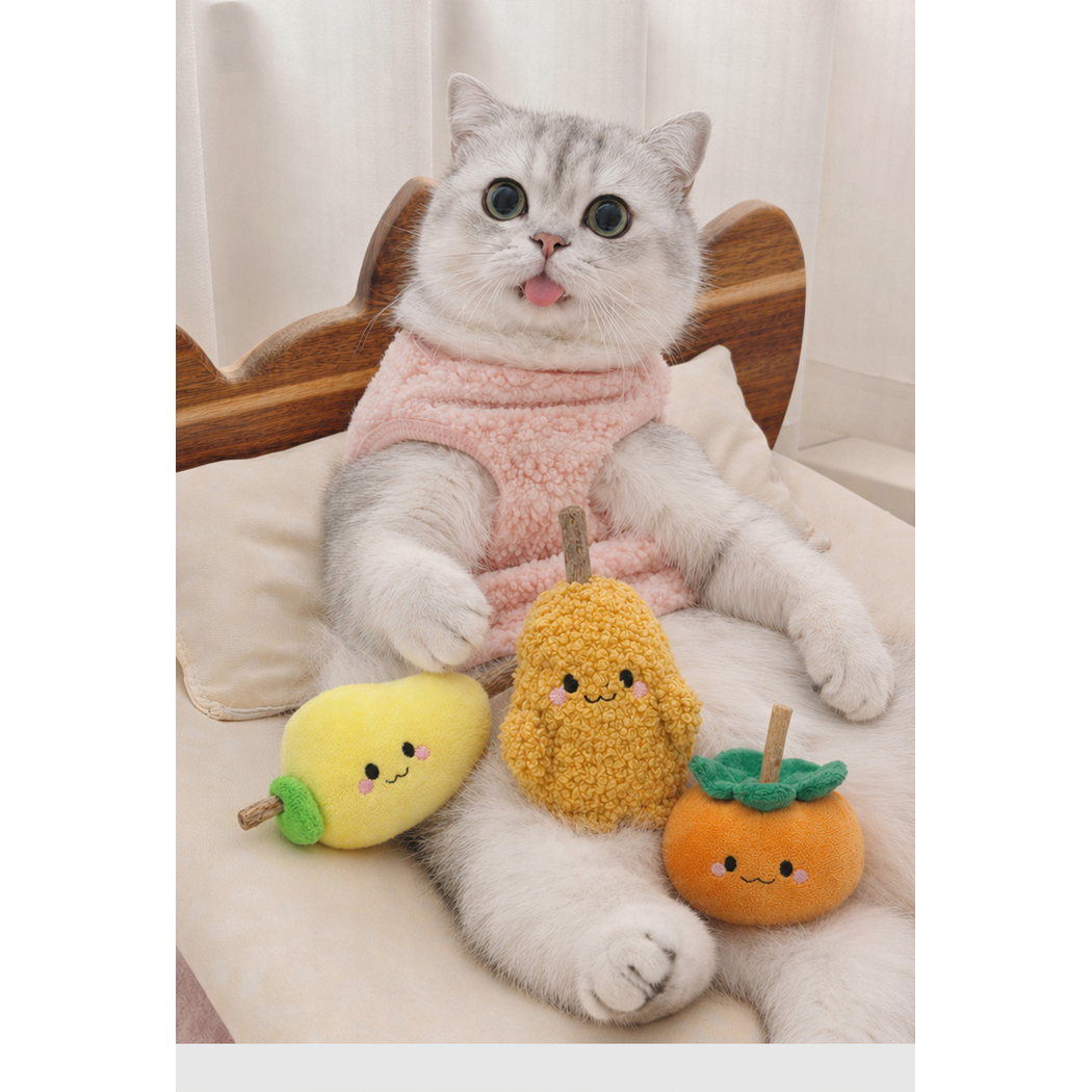 Cat seated with Potato, Persimmon, and Mango character cat toys on its lap