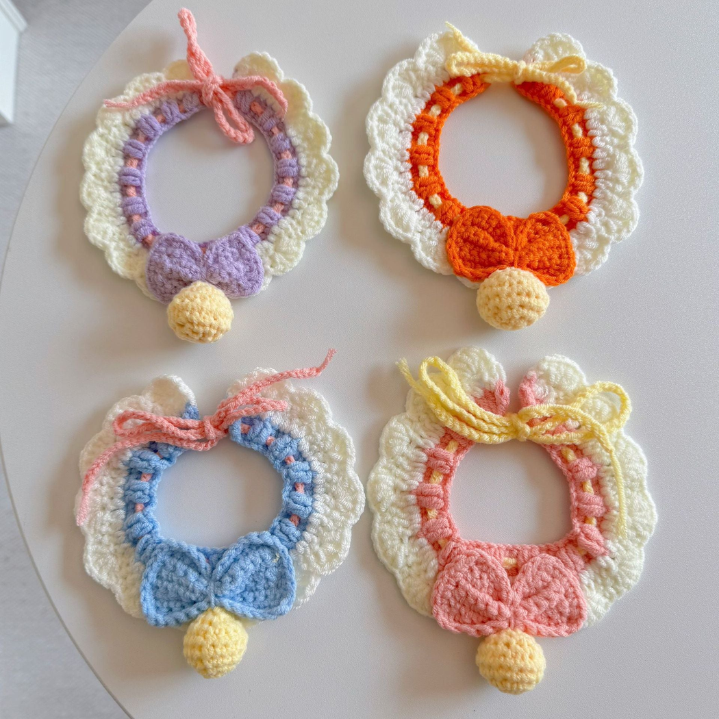 Multiple styles of pet neckwear displayed together