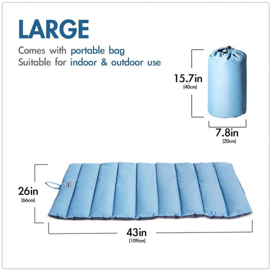 Folded outdoor dog bed in included carry bag next to mat for travel