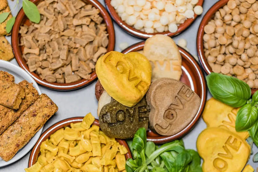 Assorted dog treats and fresh ingredients