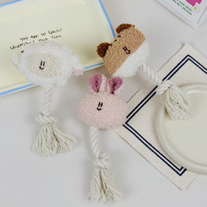 Petkin animal plush dog toy shaped like a brown and white dog with rope tail