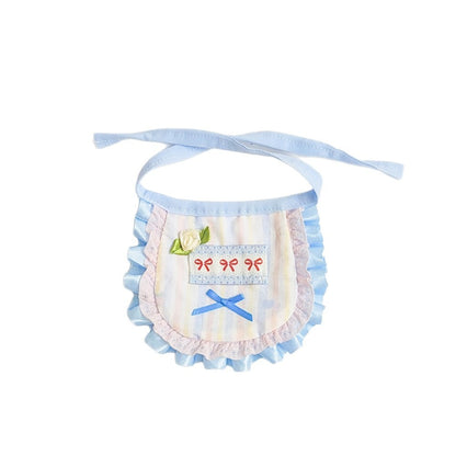 Back view of the pastel apron bib showing the adjustable strap and closure