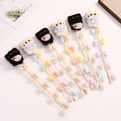 Moo plush cat teaser wand toy with colorful feathers and soft fabric on a wooden stick