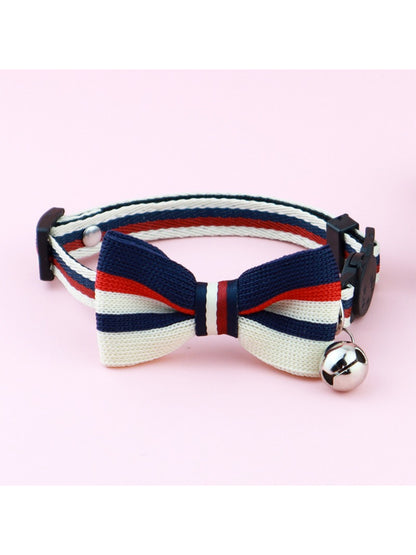 Mokka striped bow cat collar laid flat highlighting bow and striped pattern
