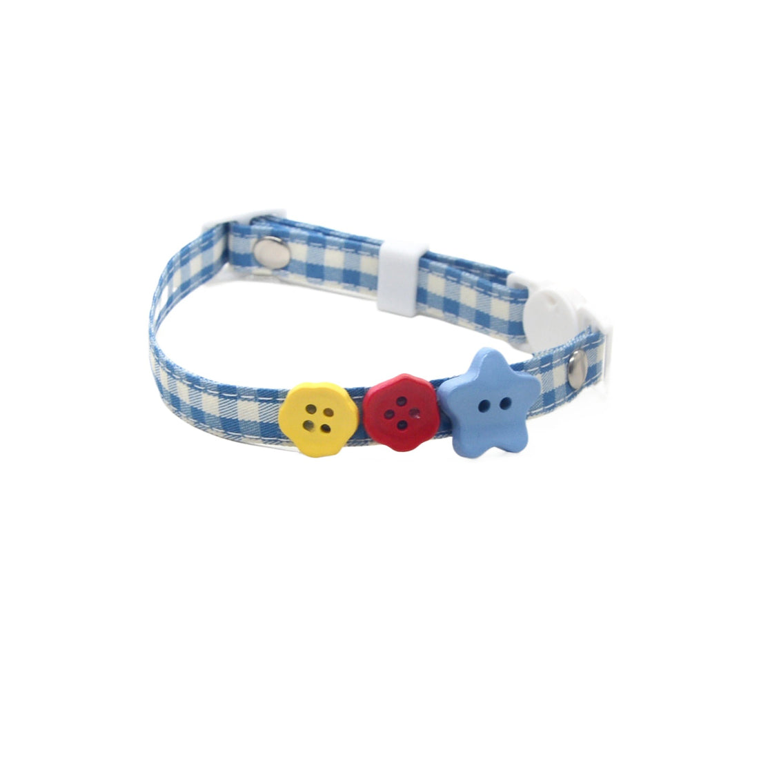 Mokka button charm attached to pink cat collar on white background