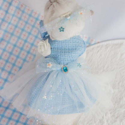 Cat sitting while wearing the pink tulle dress with bow detail