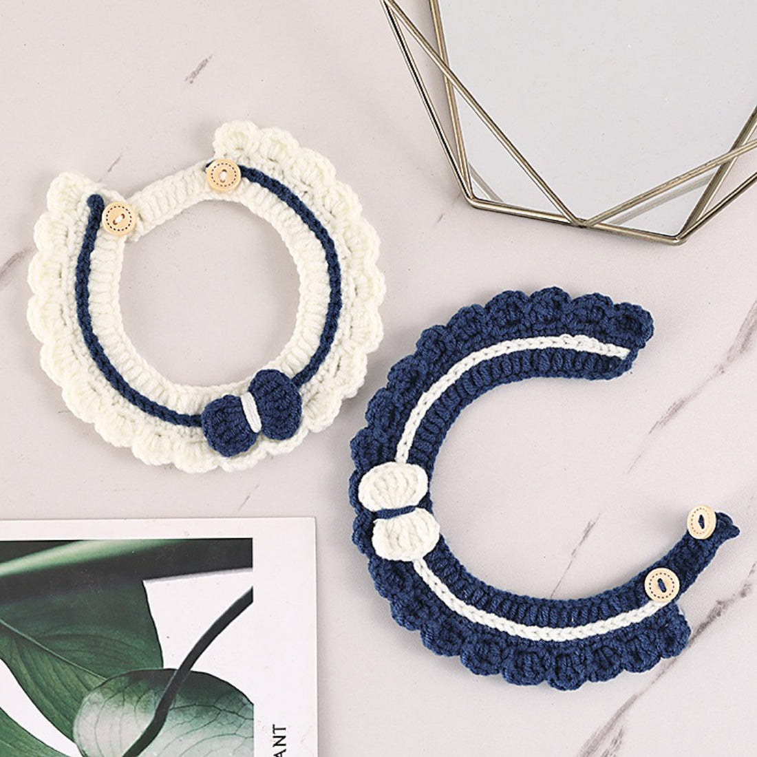 Mokka crochet cat collar displayed flat showing button and bell details