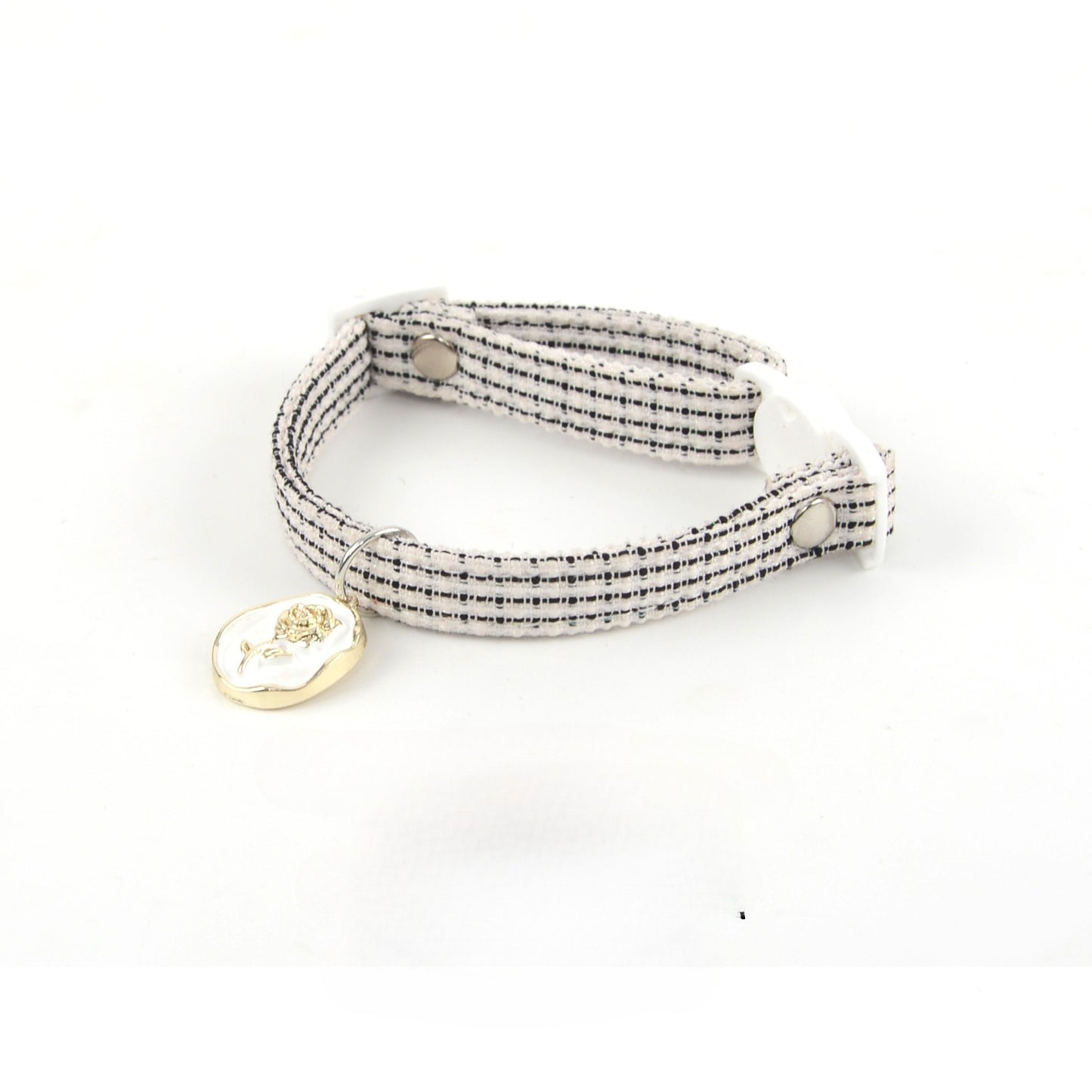 Mokka Rose Charm cat collar wrapped around a cylindrical object
