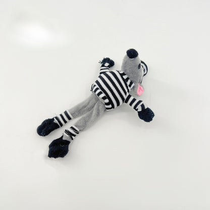 Moo mouse shape cat toy photographed from above on a neutral background