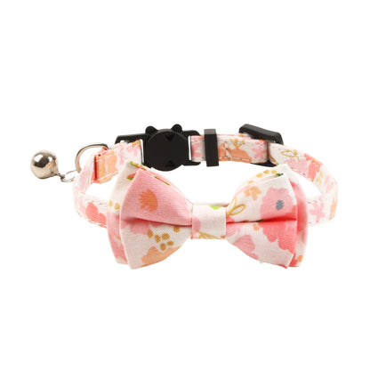 Mokka cat collar featuring a floral and gingham bow laid flat