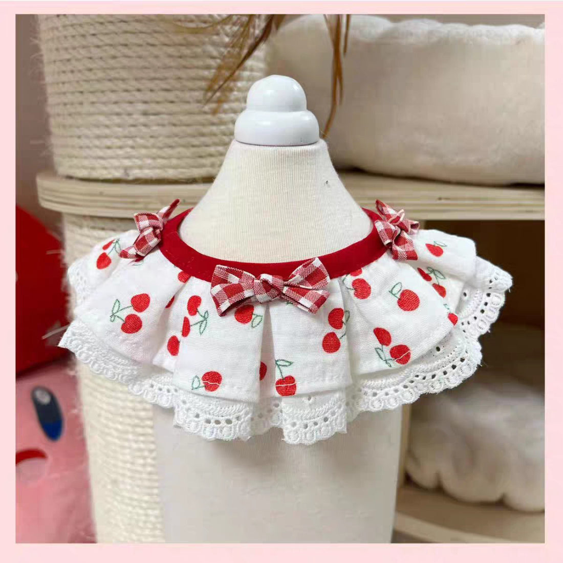 Close-up of Mokka Sweet Cherry cat collar showing cherry design and metal bell