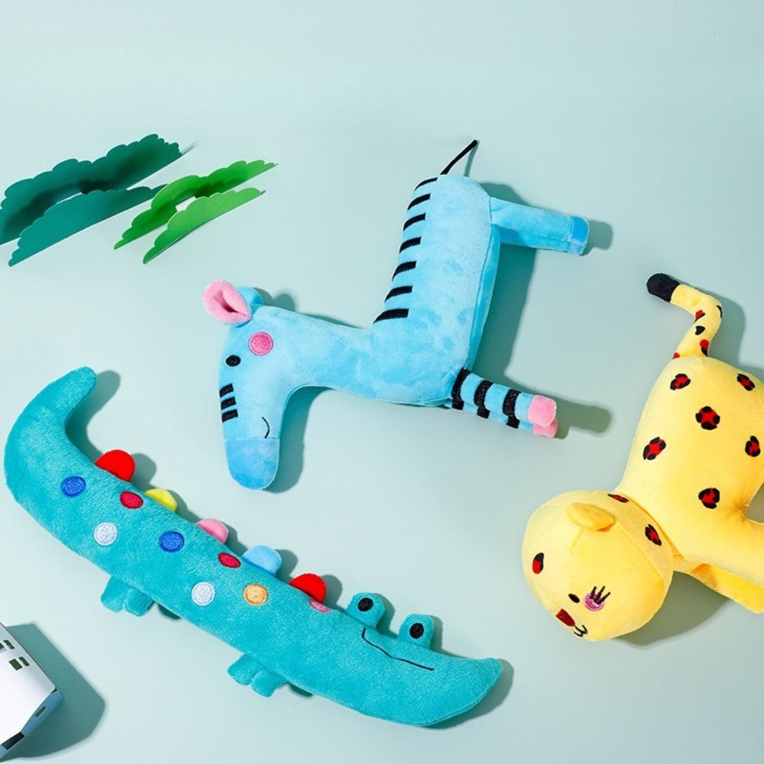 Close-up of Petkin cartoon animal plush dog toy showing soft texture and vibrant colors