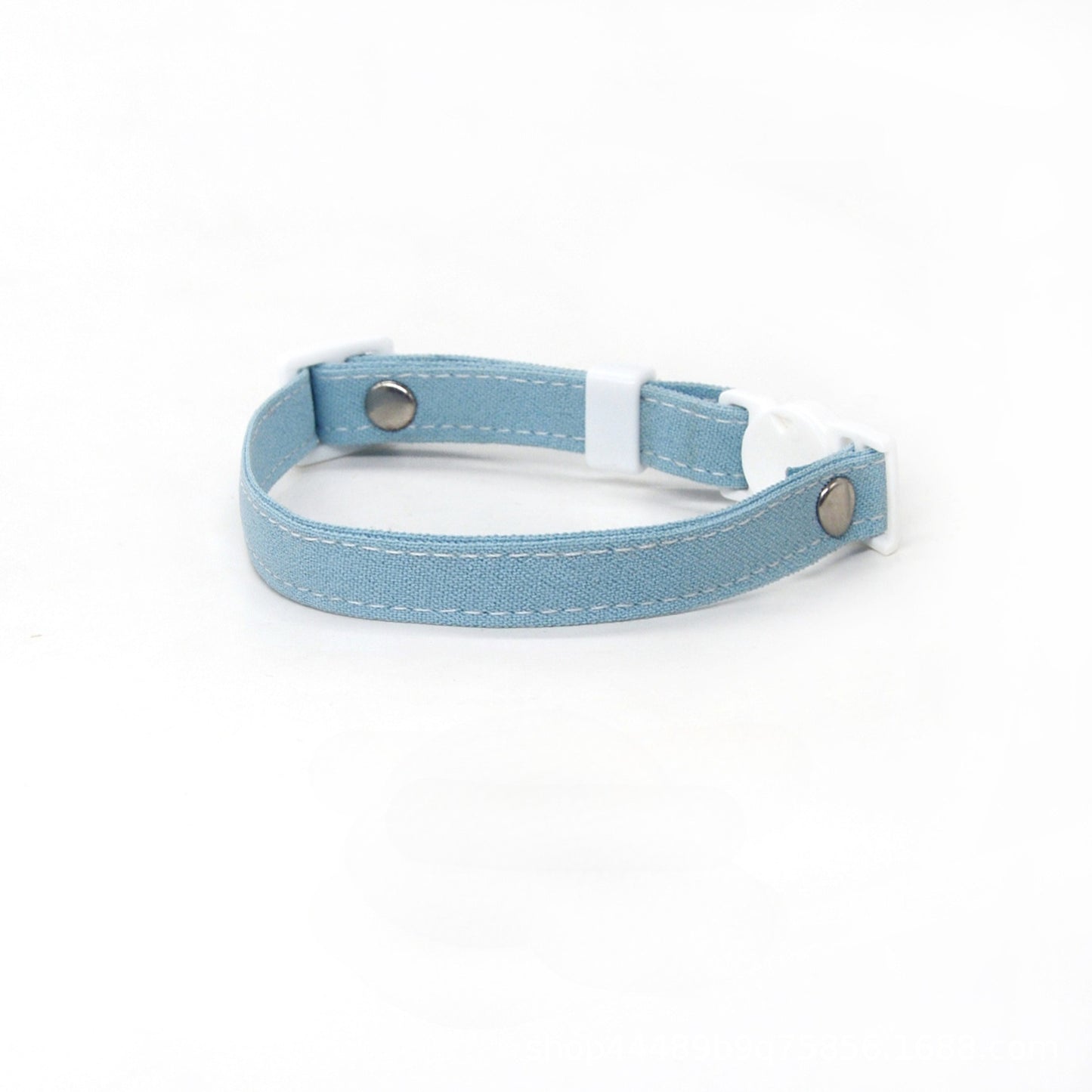 Mokka cat collar laid flat displaying adjustable strap and metal ring