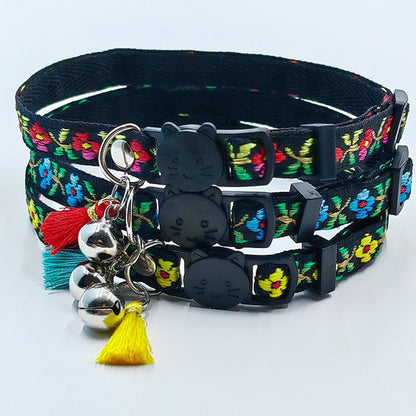 Close-up of Mokka floral cat collar showing tassel and small bell detail