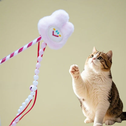 Close-up of Moo plush cat teaser wand showing soft plush and beads