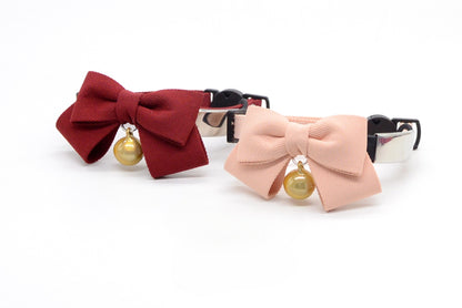 Side view of Mokka breakaway cat collar with bow on white background