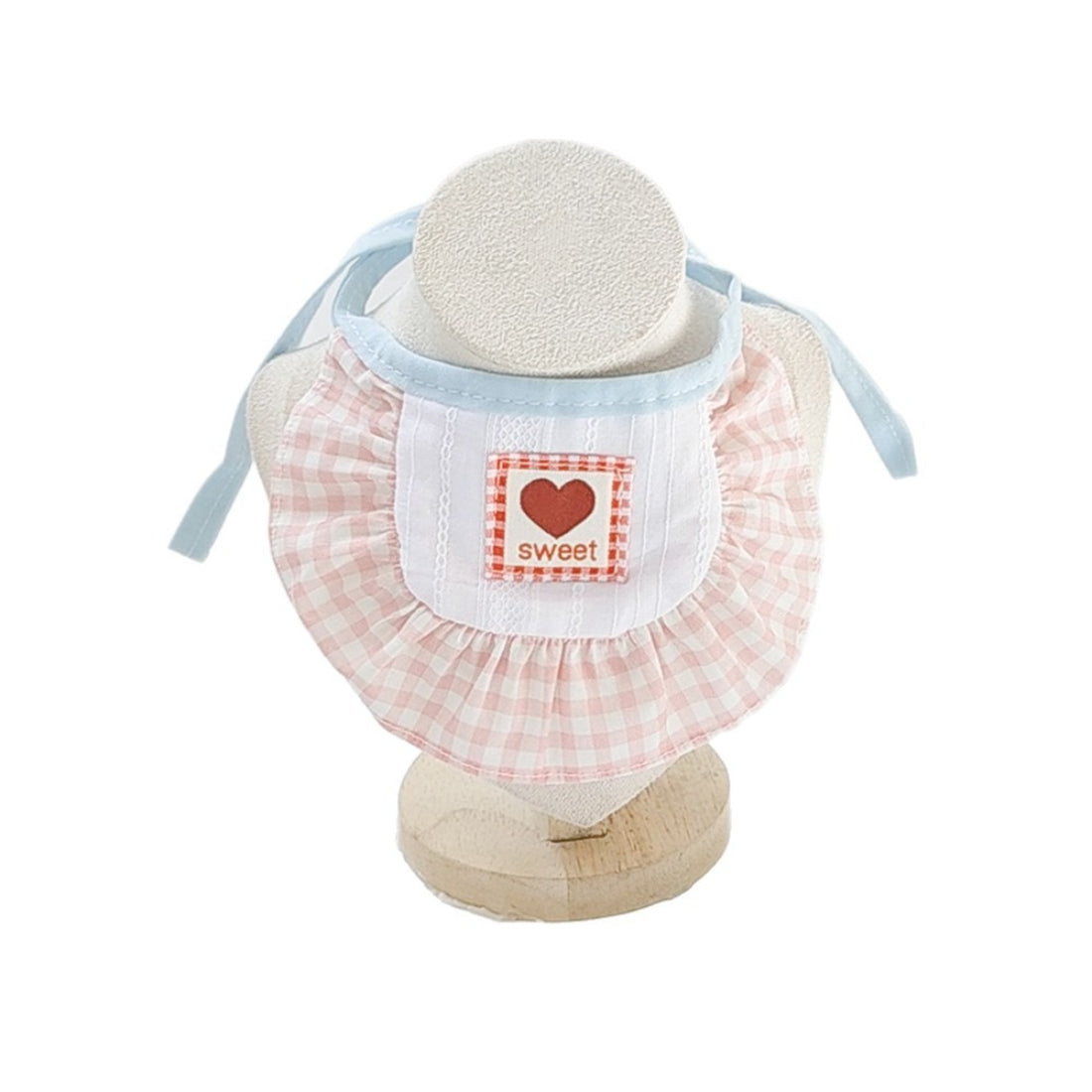 Side view of baby wearing Mokka Sweet Patch Cat Bib with adjustable neck strap