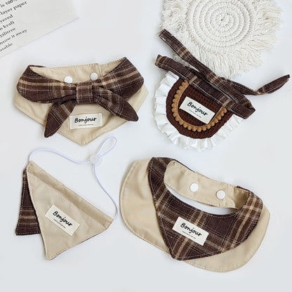 Brown ruffle cat bib with adjustable strap on a white background