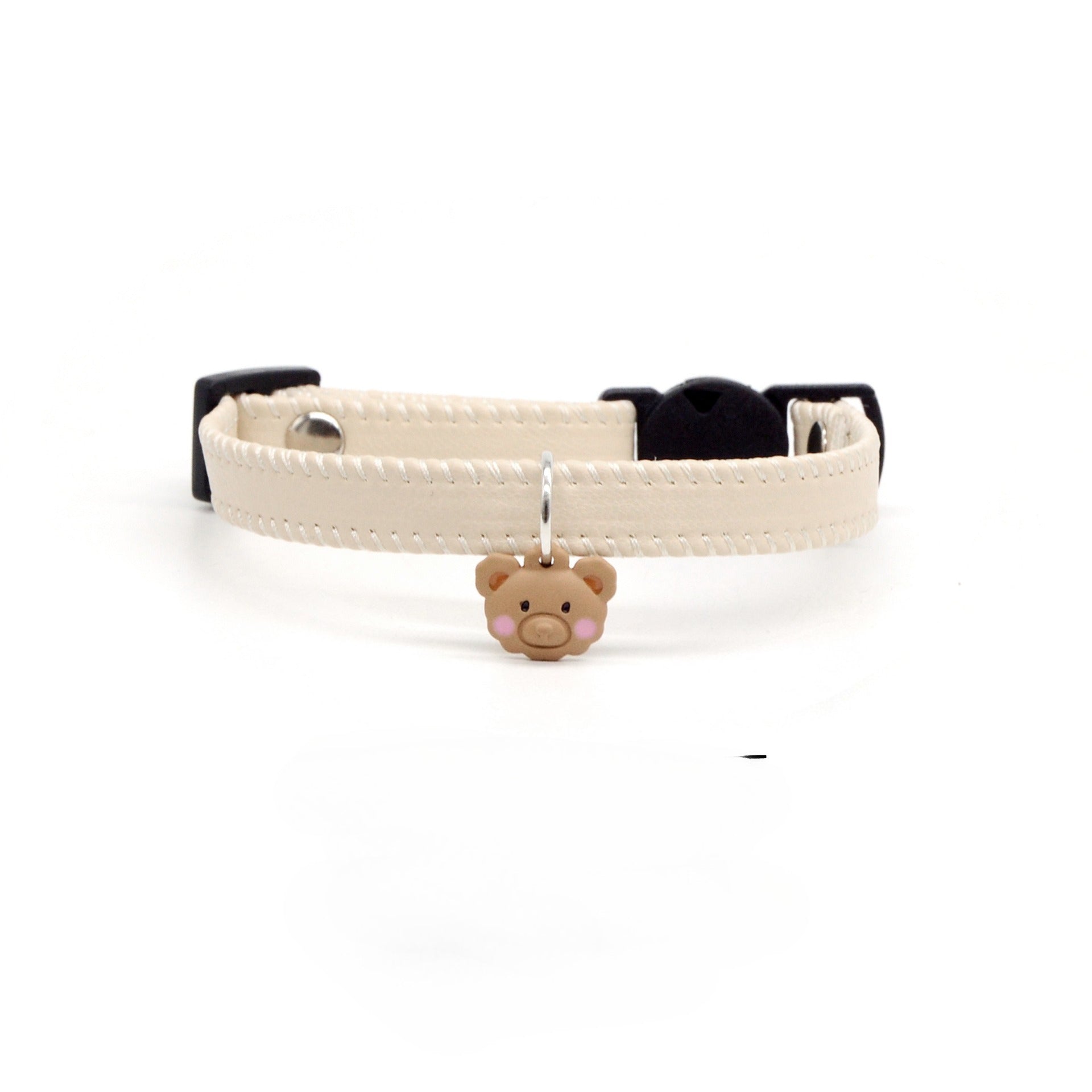 Mokka bear charm attached to brown leather breakaway cat collar with metal buckle