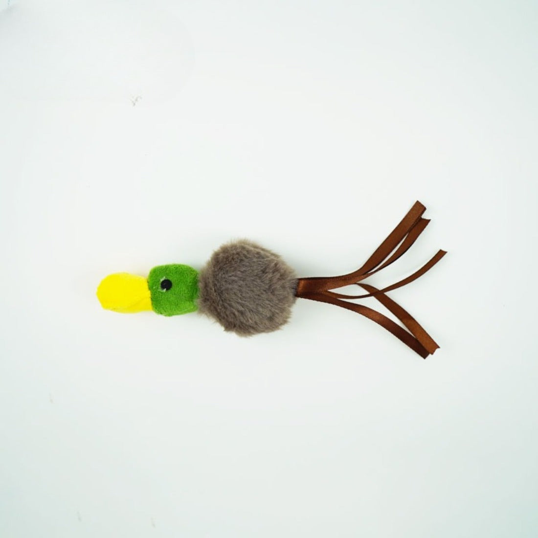 Cat playing with Moo fluffy bird toy on stick, engaging with feathers