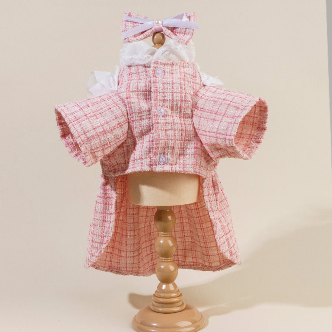 Side view of Ozzie Bow Tweed Cat Top showing textured tweed fabric and button accents
