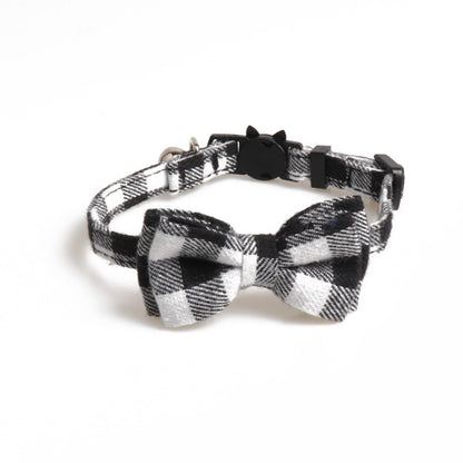 Red and black plaid bow tie on Mokka adjustable breakaway cat collar against white background