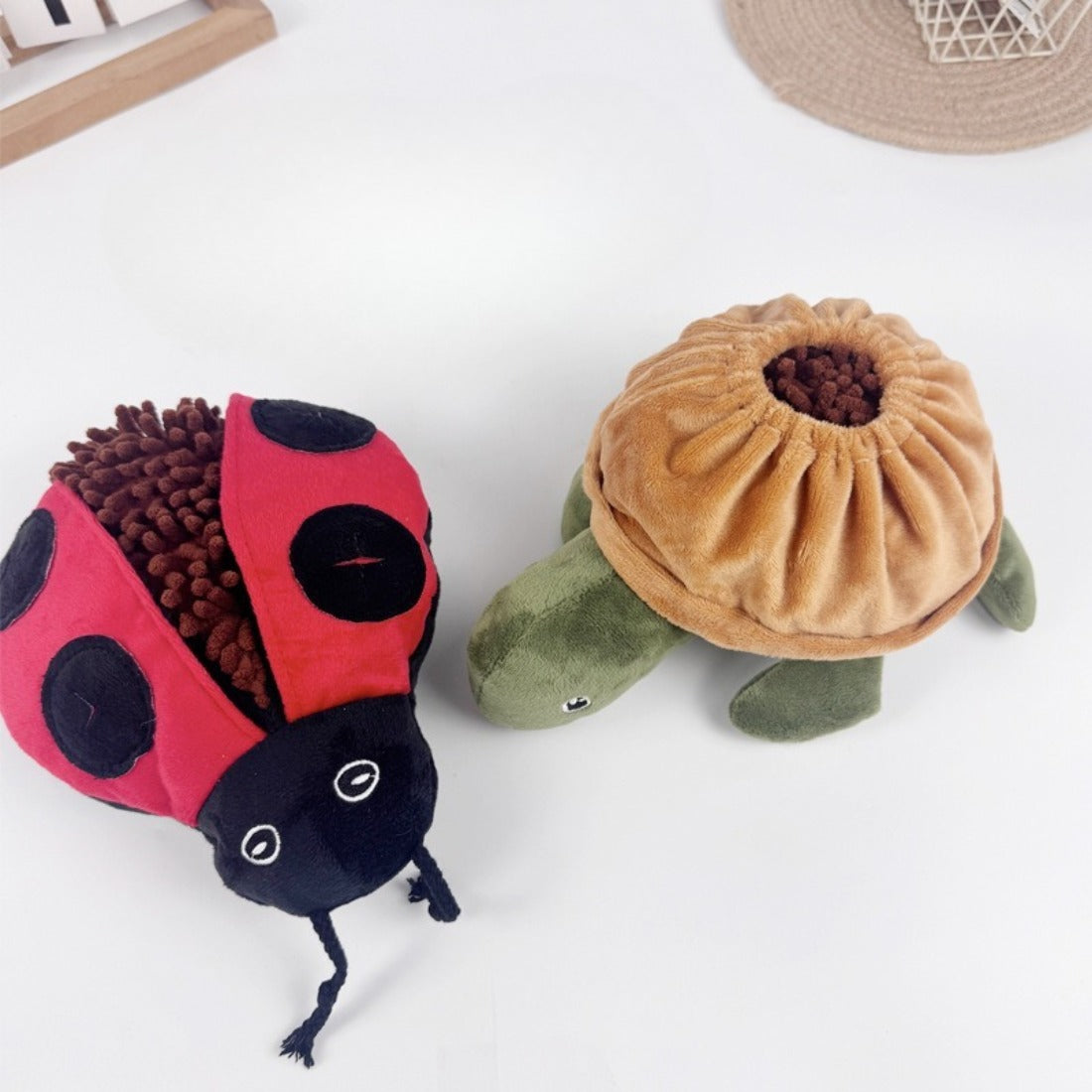 Close-up of Snuffy plush toy showing textured fabric folds for scent hiding