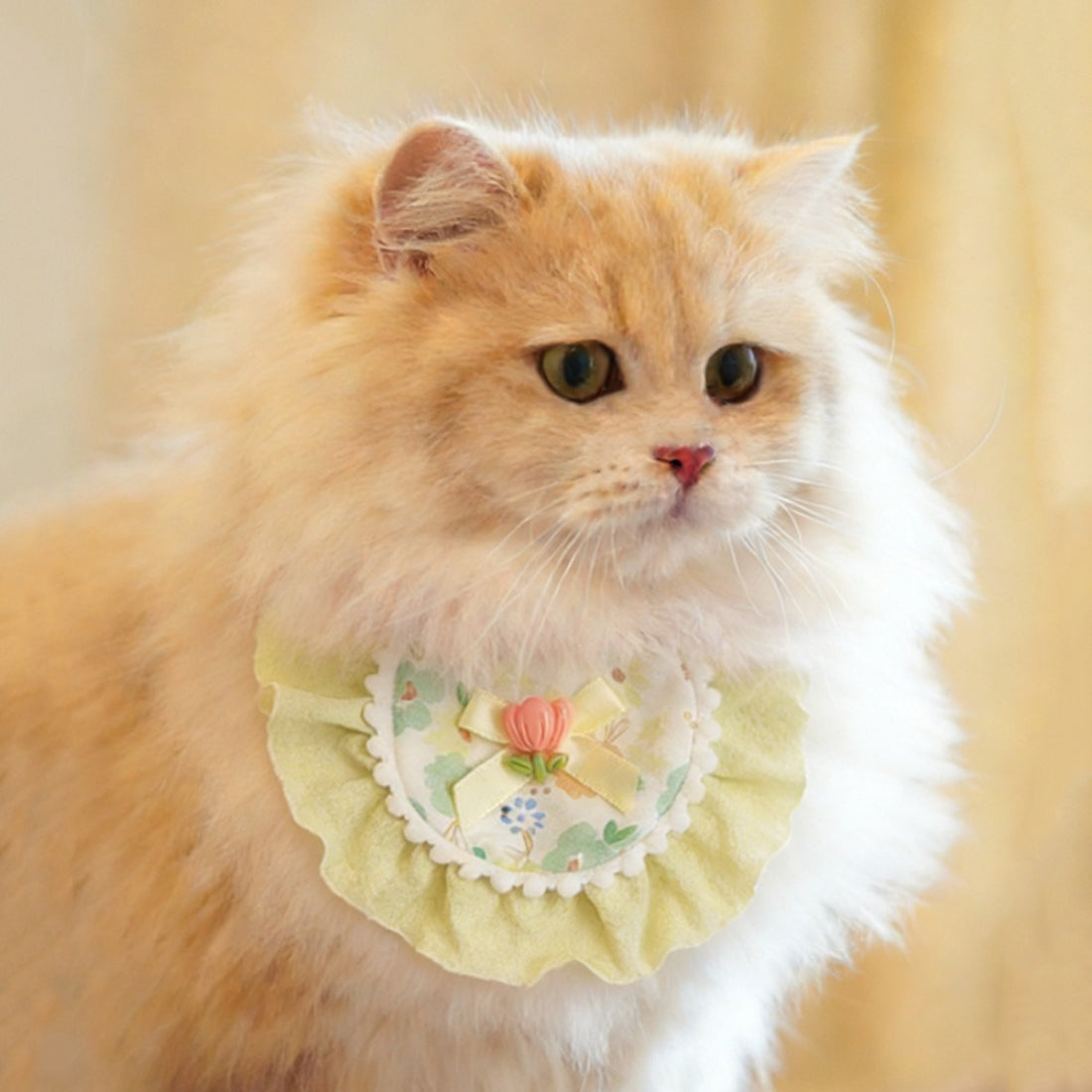 Mokka floral bow cat bib with pink and white flower pattern on soft fabric