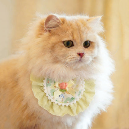 Mokka floral bow cat bib with pink and white flower pattern on soft fabric