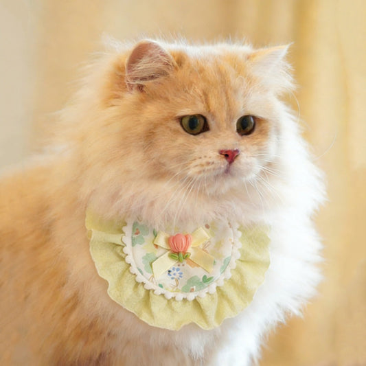 Mokka floral bow cat bib with pink and white flower pattern on soft fabric