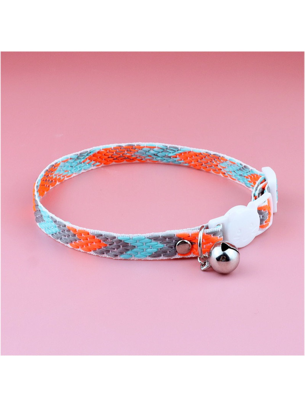 Cat wearing bright geometric patterned collar with adjustable fit