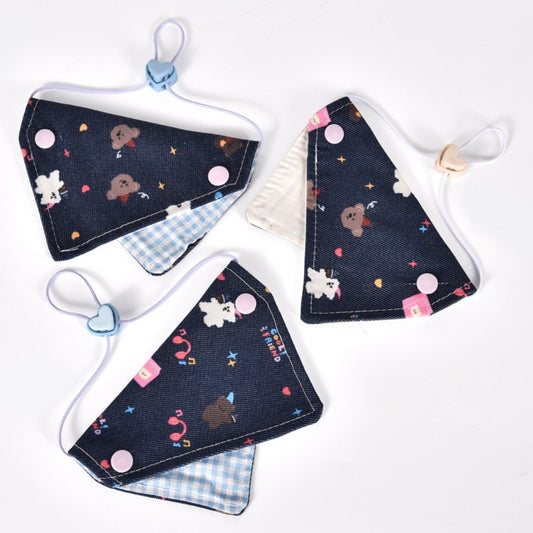 Mokka cartoon print cat bandana collar laid flat showing colorful cat illustrations