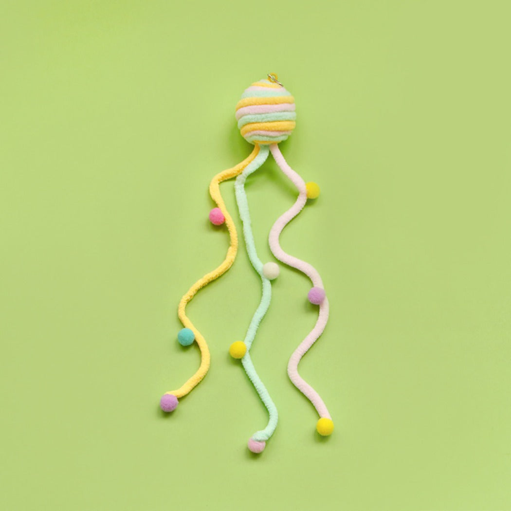 Moo colorful toss cat toy displayed on a flat surface highlighting its interactive features