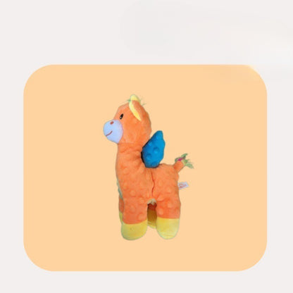 Petkin Winged Horse dog plush toy laying on a white surface with wings spread