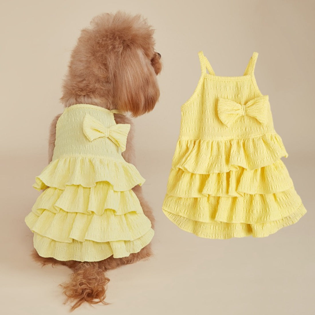 Back view of dog in Ozzie summer ruffle dress with bow, highlighting ruffle layers