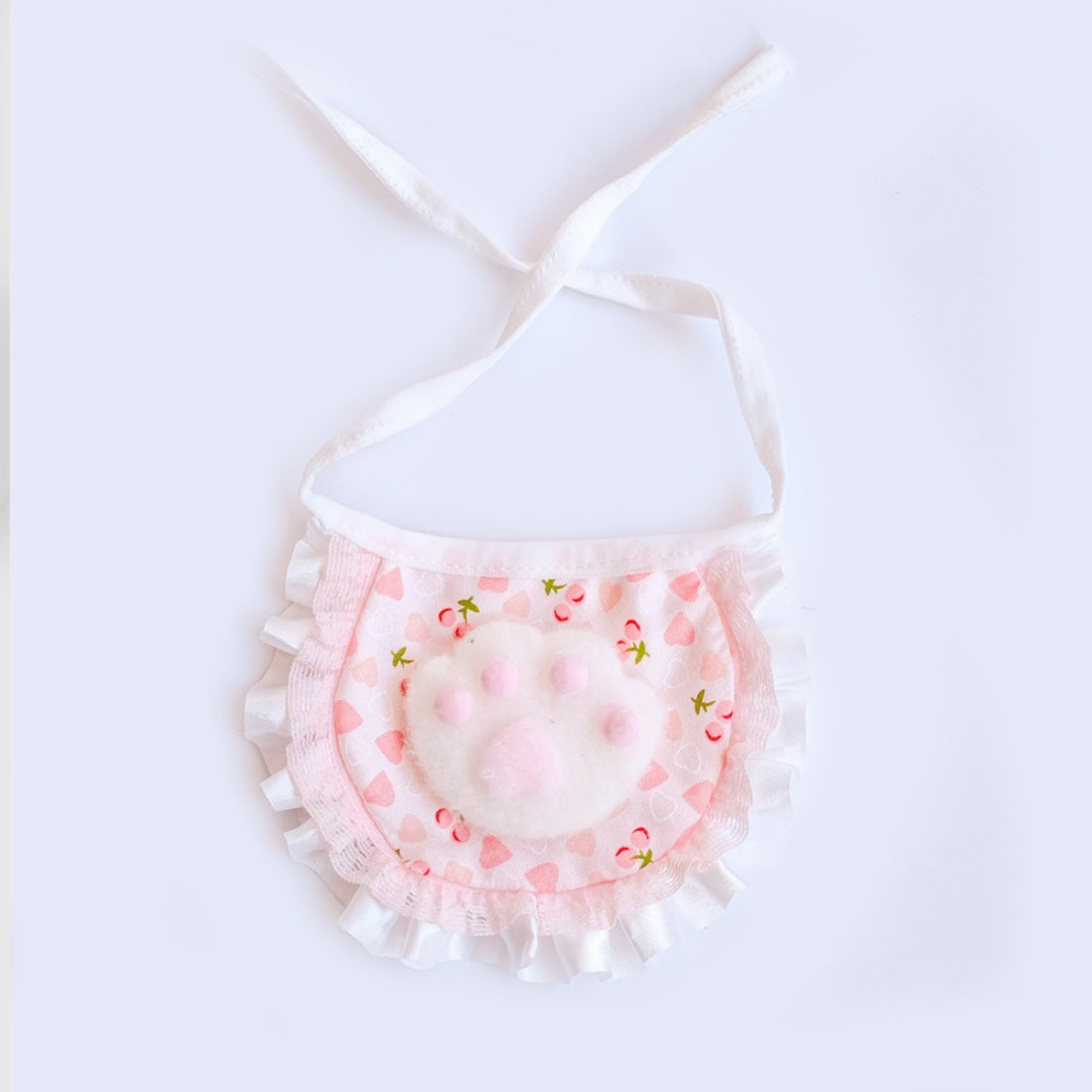 Side view of Mokka Ruffle Paw Cat Bib showing ruffle detail and paw prints