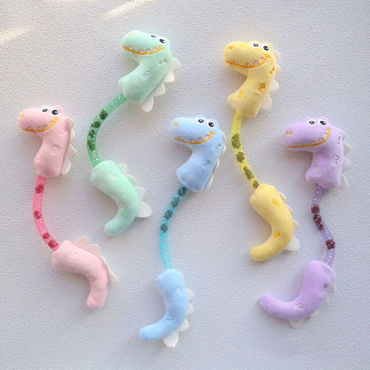 Moo Wiggly Shimmer Dinosaur cat toy with green glittery fabric and tail